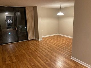 Dining room adjacent to living room at night time