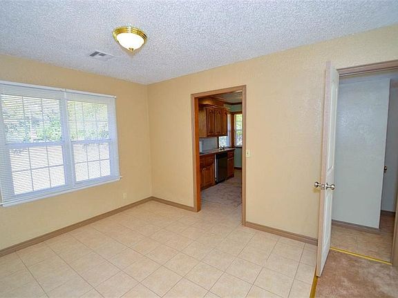 2ND PICTURE OF DINING ROOM.  SHOWS A LITTLE OF THE KITCHEN