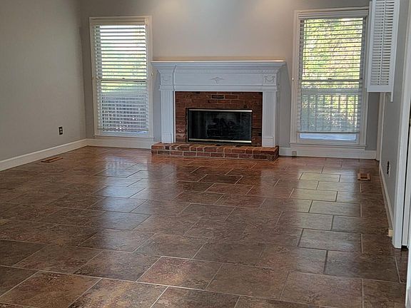 Tiled Family Room with gas fireplace.