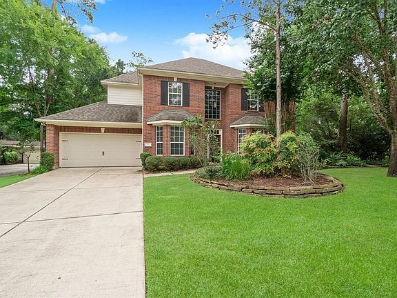 Lush landscaping leads you and your guest to the beautiful leaded glass door entry of the home!