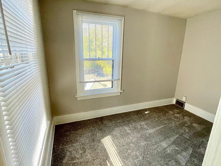 Walk-in closet of primary bedroom
