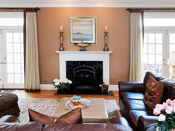 Fireplace; french doors lead to deck & terrace