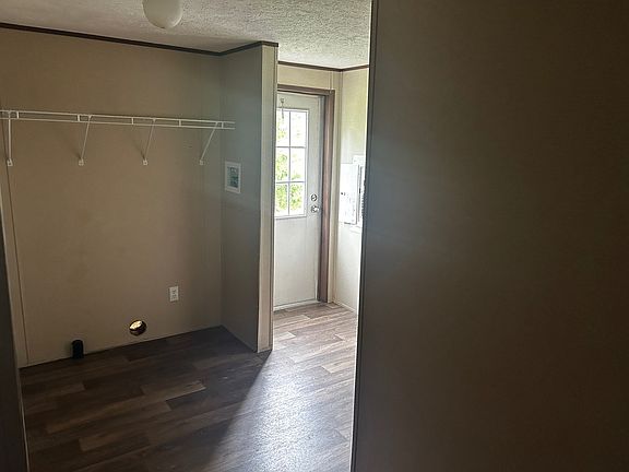 Utility Room with Washer and Dryer connections and rear exit door.