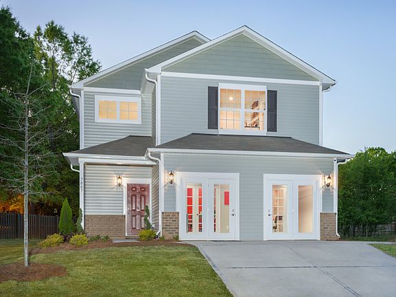 Harris Exterior 8 features brick accents, siding, shakes, covered front door and 2 car garage Sales