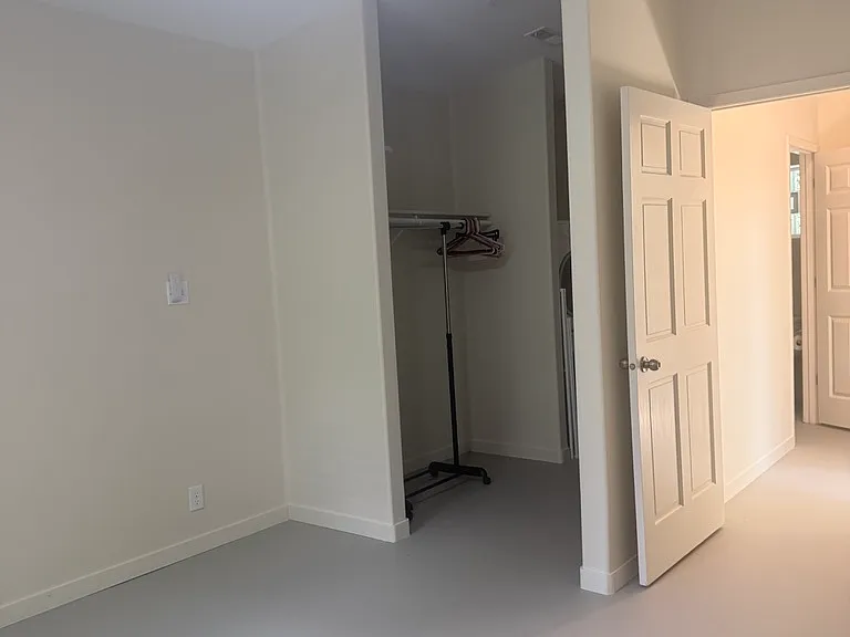 Bedroom looking into hall and into closet.