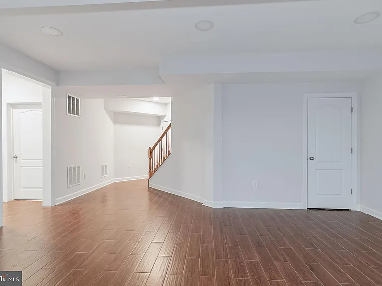 Basement living space with under staircase storage