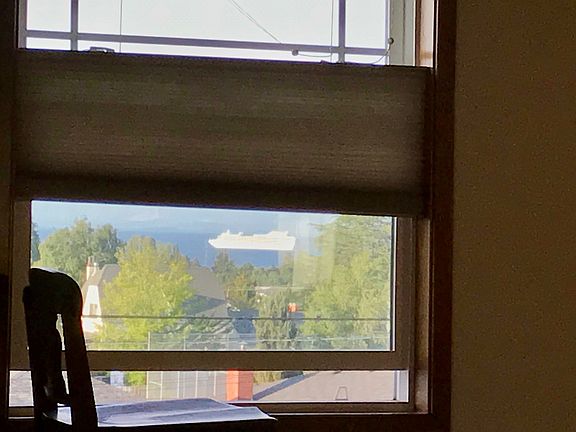 Watch cruise ships from bed