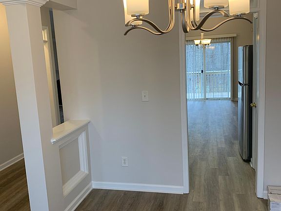 From dinning room looking into kitchen to rear sliding door and elevated deck