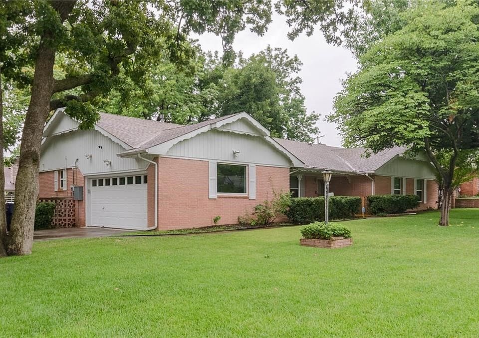 4900 NW 33rd - Large corner lot with three living areas, three beds, and 2 1/2 baths. This is an established neighborhood with a park-like feel. People walk their dogs, and it has beautiful tree lines streets.