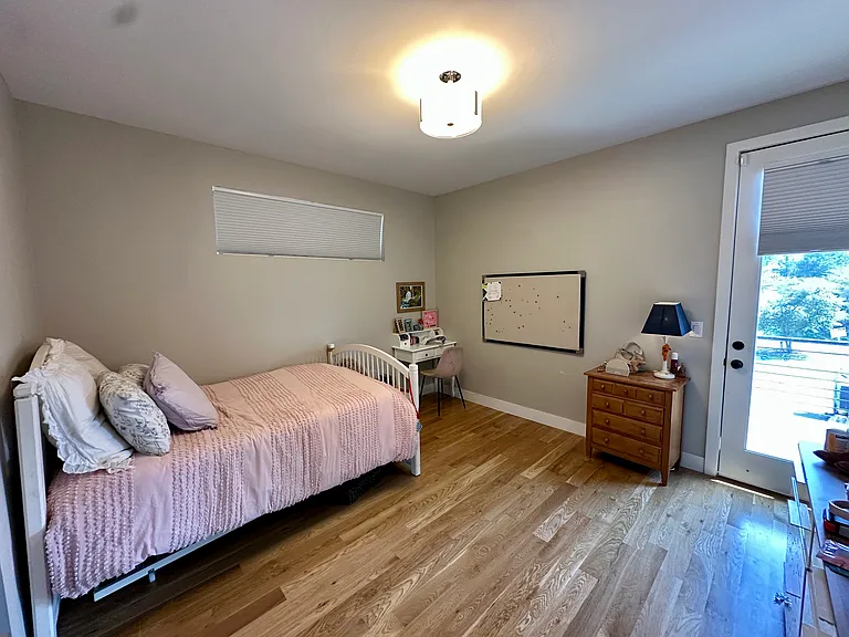 Second floor bedroom with private deck overlooking downtown & Hallack park.