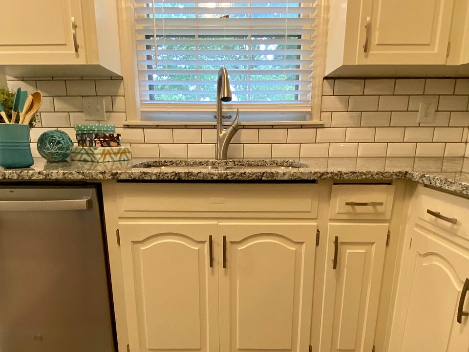 Granite countertops, subway tile backsplash