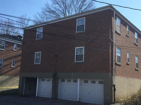 Note the 4 new garage doors! The door on the left is just raised