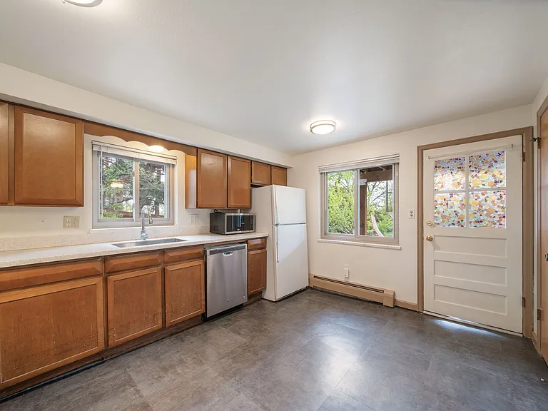 Kitchen area and coat closet