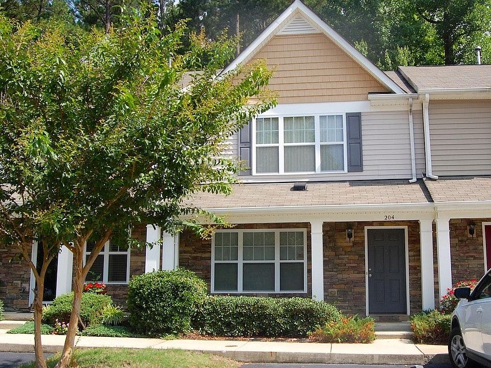Beautiful covered front porch with stone elevation