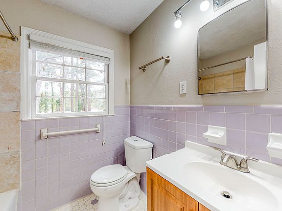 Shared bathroom with bathtub