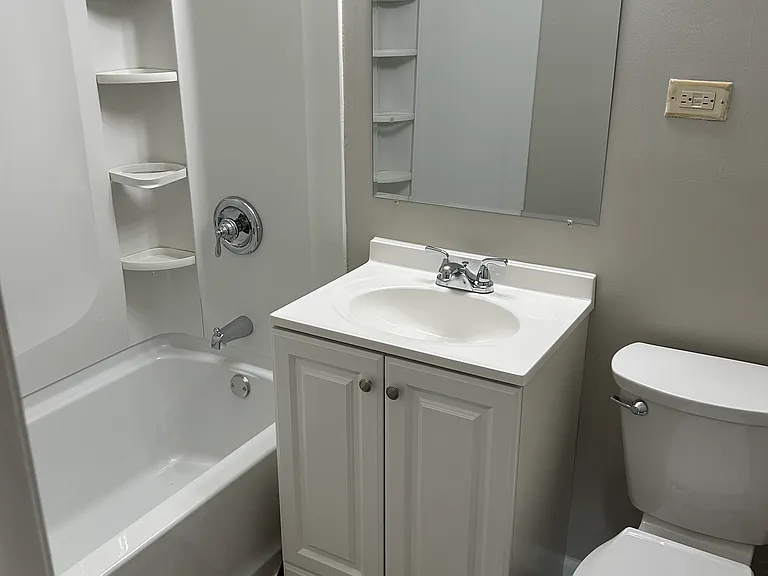 Bathroom completely redone, new flooring tub/shower, vanity and commode