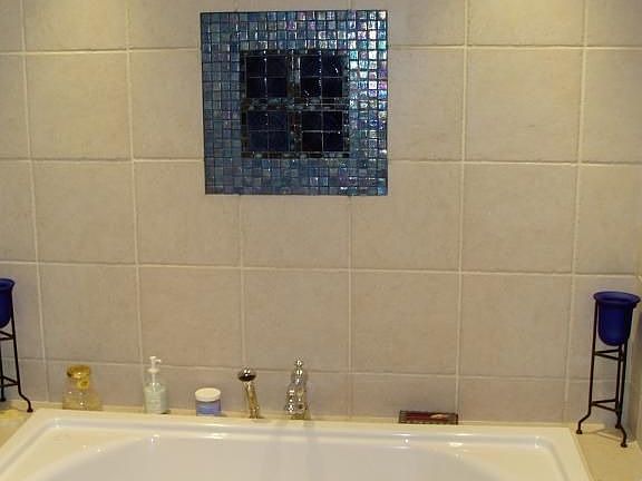 designer bathroom with whirlpool and magnificant tile work