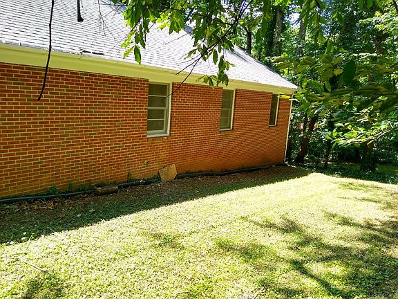 Private back yard with woods on one side.