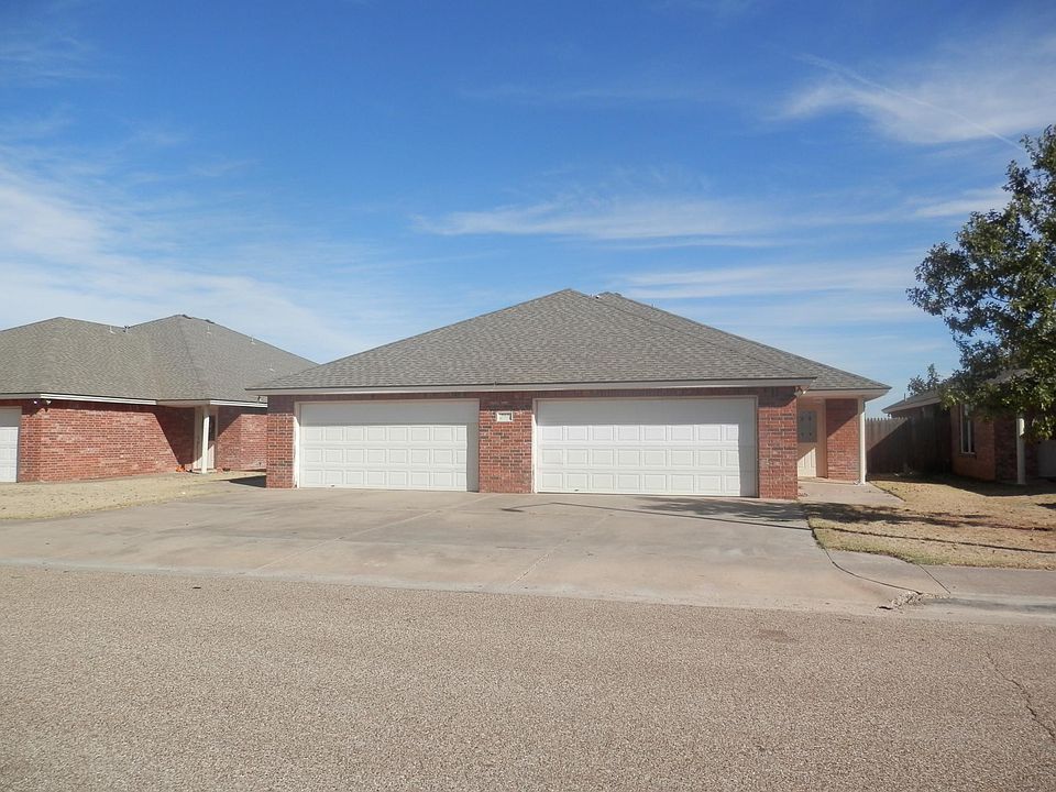 Front View
Ample driveway for two additional cars in front of 2 car garage