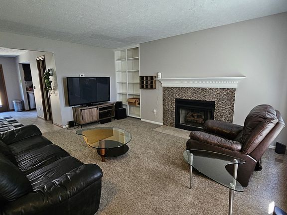 Living Room with decorative fireplace
