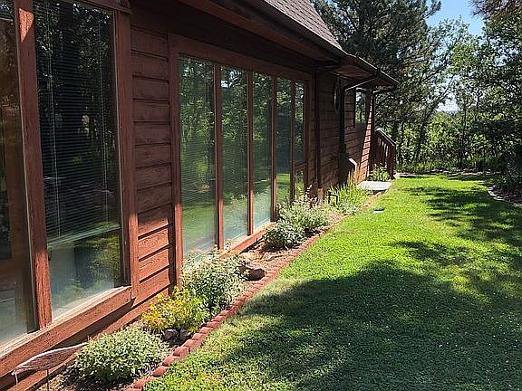 Front yard, large windows 