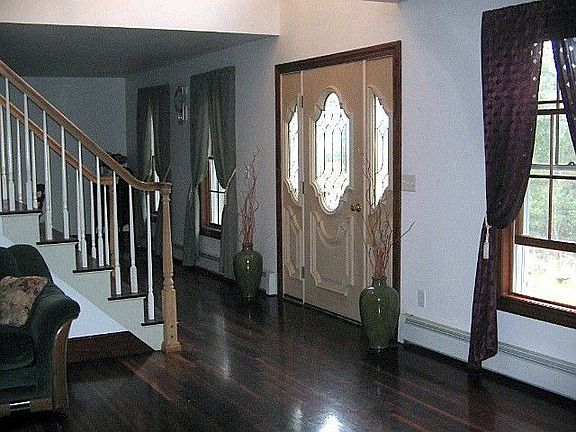 Looking from Living Room to Dining Room, front door and staircase
