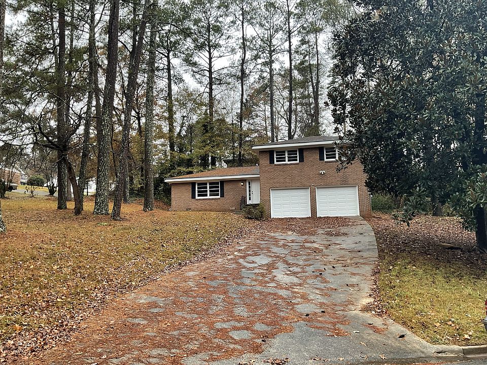 Front of home with two car garage on a 1/2-acre corner lot.