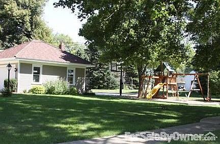 View of Play Set and backyard : View of play set in backyard, including 2-car garage and parking pad