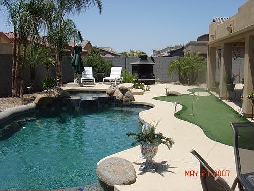 Back Yard pool and Putting Green