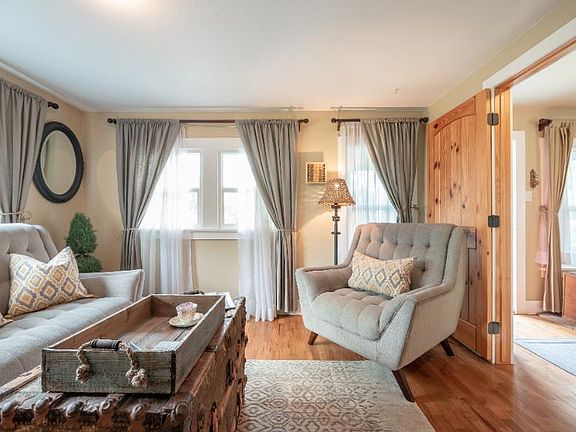 Entry to house and second living area with beautiful custom wood doors which can close for privacy.