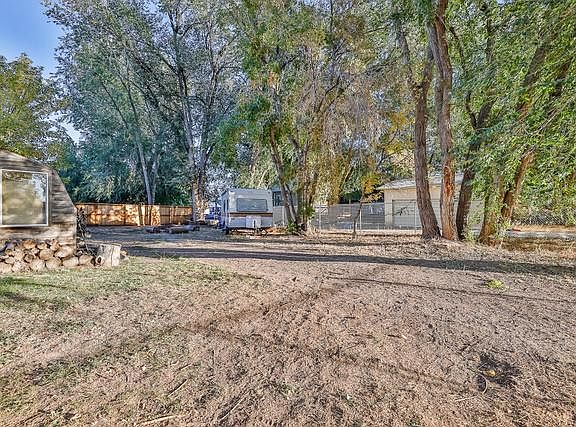 Huge fully fenced yard with access from the back for RV/camper/trailer parking and great for pets