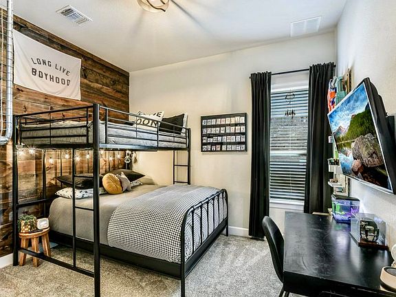 Rustic wood plank accent wall gives this bedroom its own personality. Fresh paint, clean carpets, and new fixtures - truly move-in ready