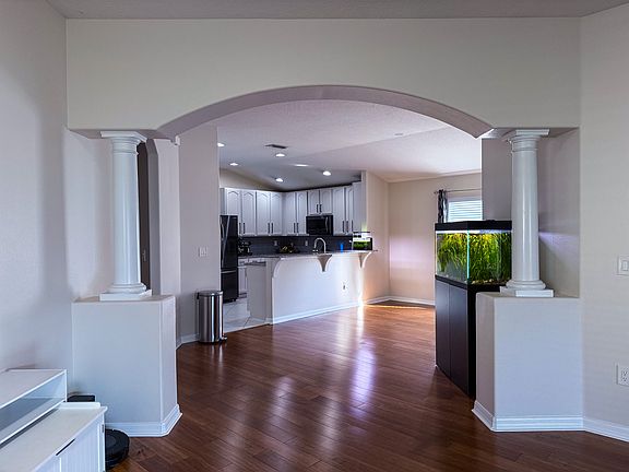 Facing dining room and kitchen from front entry