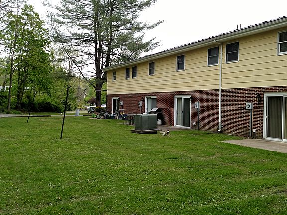 Concrete slab patio area for each unit