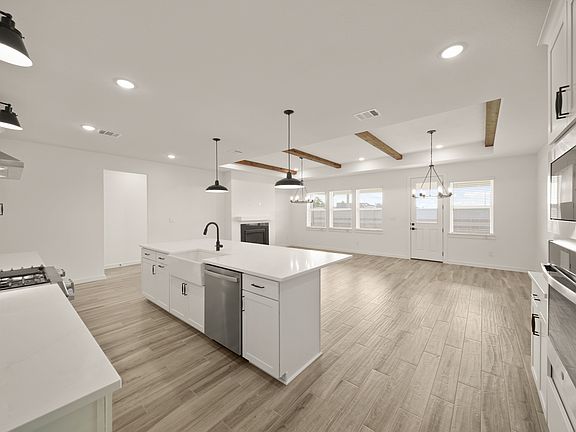 Kitchen with white apron-front sink