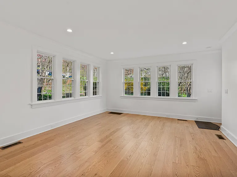 Dining area surrounded by 8 windows.