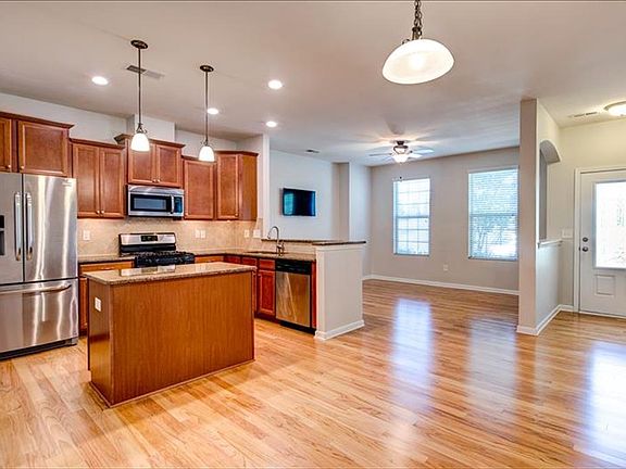 Open floorplan with gleaming hardwoods.