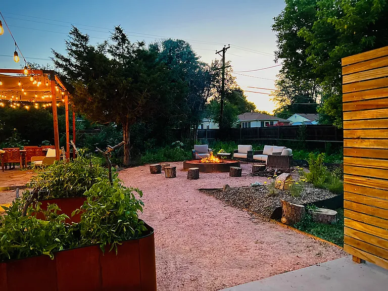 Raised garden beds. Accessible pathways and easy to maintain garden with auto water timers, mature trees and sparkly lights to create the perfect home sanctuary of relaxation.