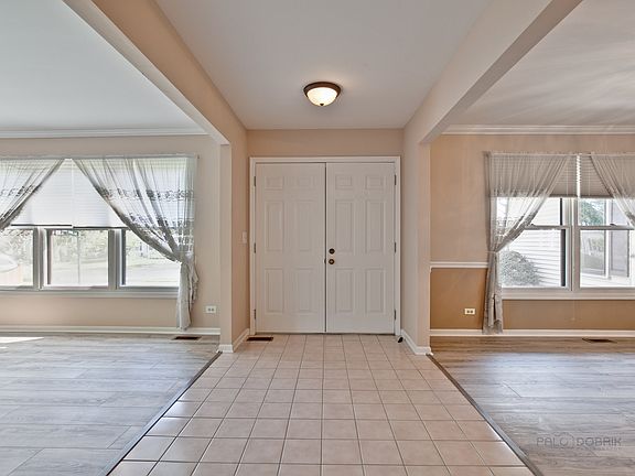 Looking back at the foyer with the formal living and dining rooms on each side.