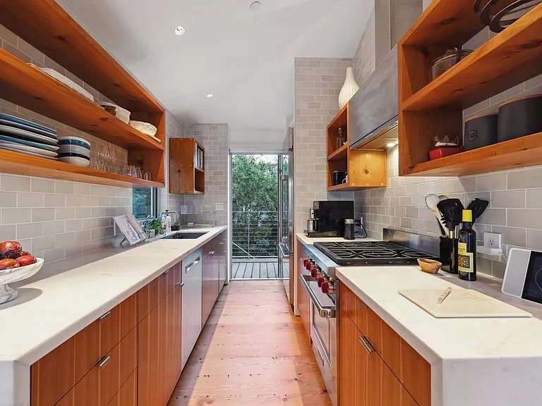 Gourmet kitchen with carera marble countertops and Heath tiles with custom cabinets.