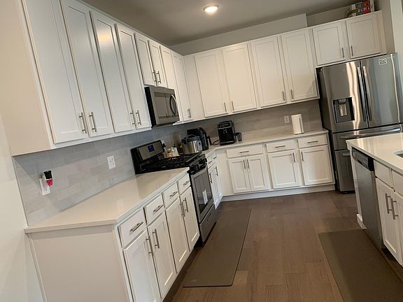 Open Kitchen with lot of cupboards.