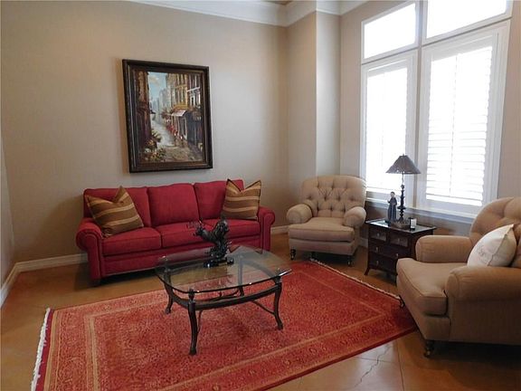 COMFORTABLE DEN OR SEPARATE SITTING AREA.