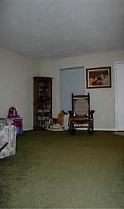 Living Room. 2 separated rooms with half wall in downstairs floor plan!