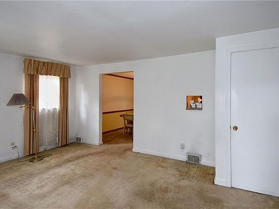 Living room with hardwood flooring.