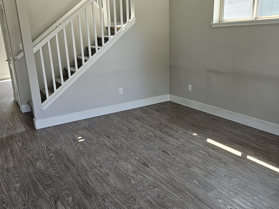 Living room with vinyl plank flooring throughout the main level.