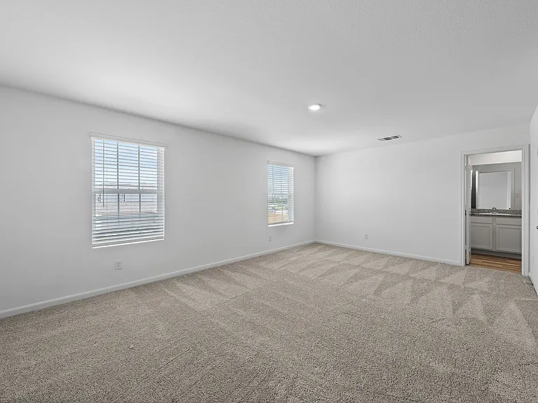 Master bedroom has a walk-in closet and private bathroom.