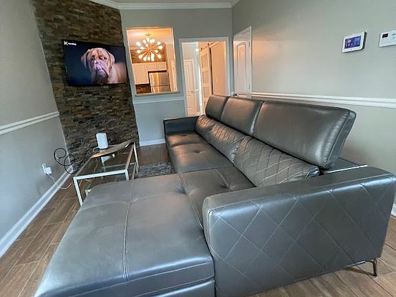 Family Room with beautiful leather sofa and new Smart T. V with Wi-Fi throughout property