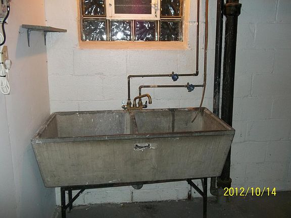 double sink in basement by washer and dryer hook up