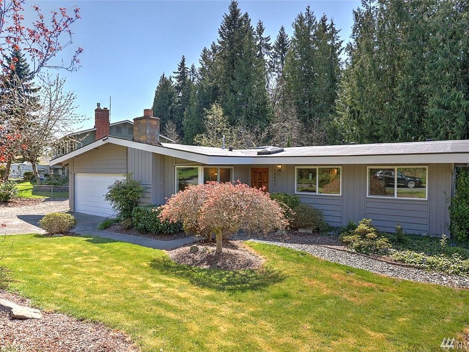 Welcome home to this charming 3 bedroom, 2 bathroom home in Boulevard Lane. This home offers adorable street appeal and mature landscaping. Enter to a light-filled living room with a lovely corner window and cozy wood burning fireplace. You will love entertaining in the over-sized kitchen and eating area with an open flow to the family room and large deck. Natural light brightens the kitchen through a huge skylight. Extend your living space outside to the entertainment sized deck through French doors off of the family room. The large backyard is fully fenced and features low maintenance landscaping. Unwind in the master suite with an ensuite bath and window view of the backyard. There are 2 additional guest bedrooms and an additional full bathroom featuring new flooring and an updated vanity.