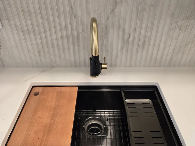 modern sink with integral cutting board and drying rack